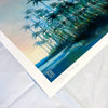 Close-up of Palms fine art print by Nick Purser, showing the signature, handwritten title and edition number on the white border beneath blue-green palm trees.